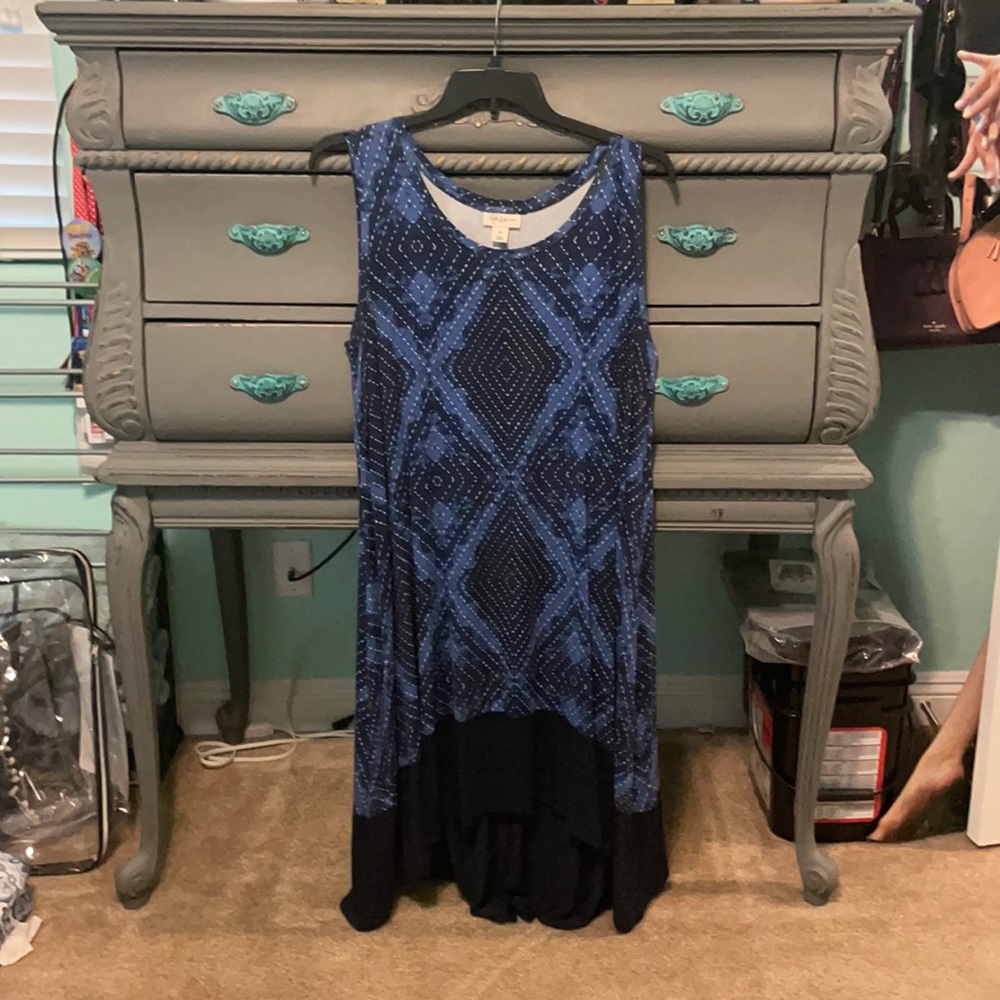 Nice dress! Love the color! Shorter in front!